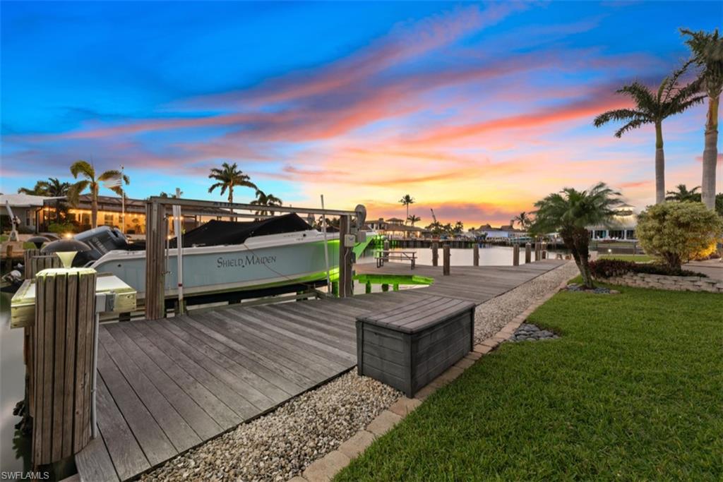 The dock and the boat lift at sunset